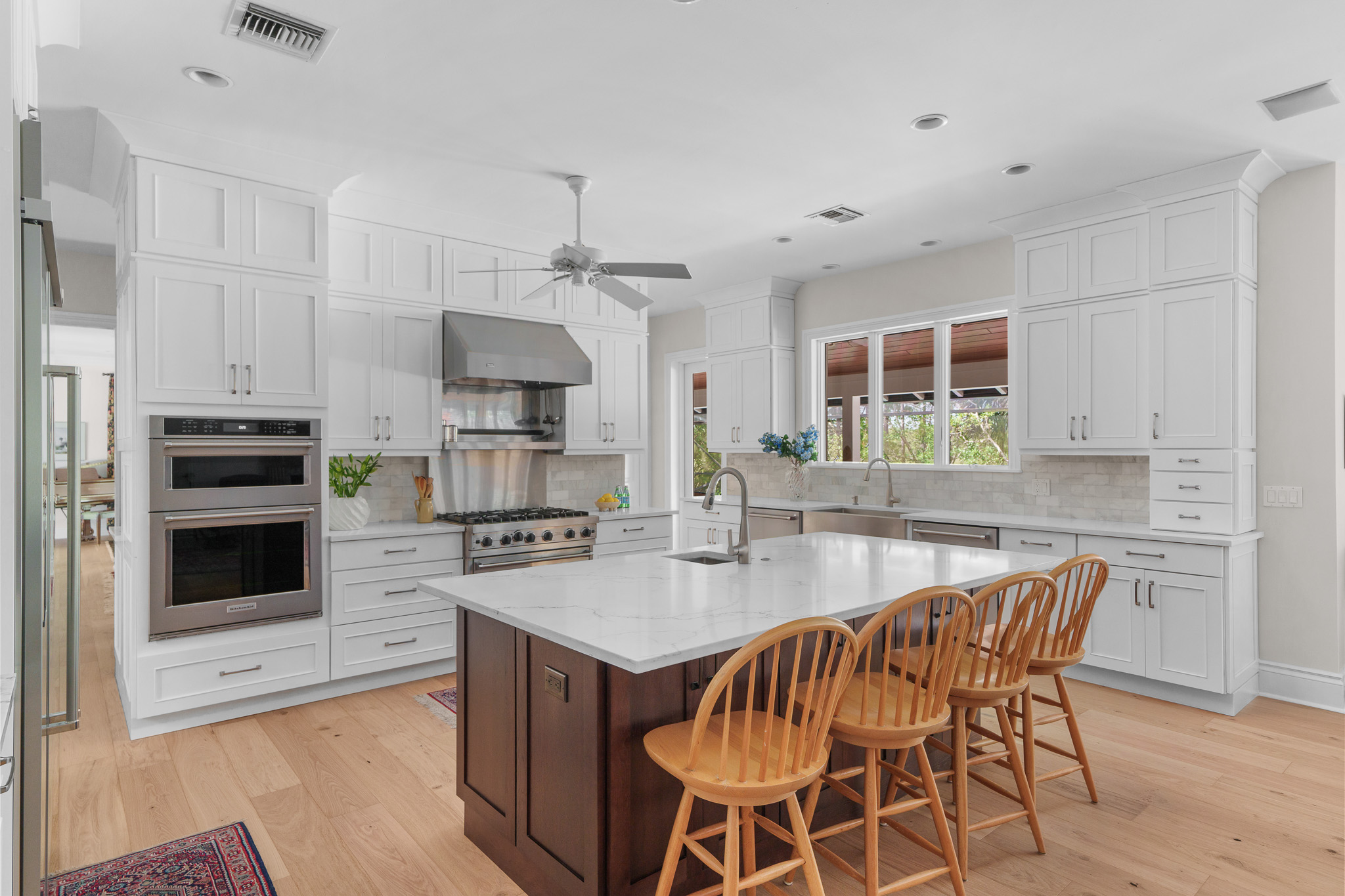 Kitchen renovation project at Old Marsh Golf Club featuring stainless appliances and custom cabinetry